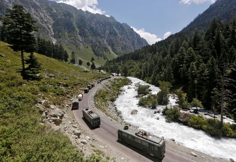 An Indian Army convoy moves along a highway leading to Ladakh, at Gagangeer in Kashmir's Ganderbal district. REUTERS/Danish Ismail  